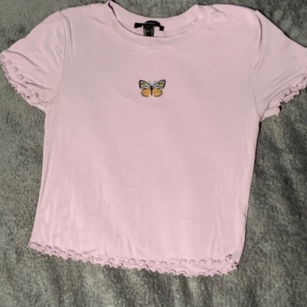 Light purple shirt with a butterfly patch